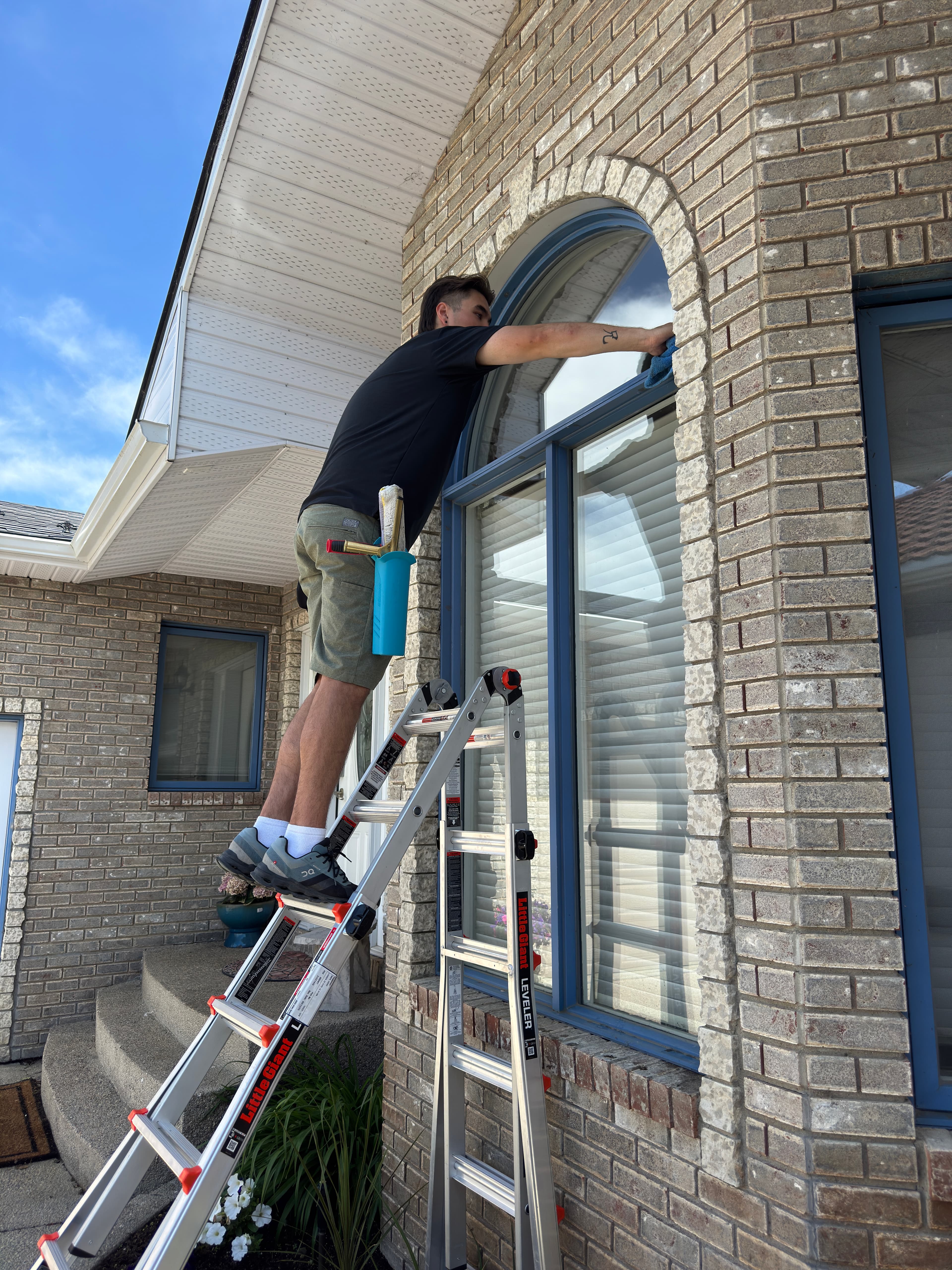 Professional gutter cleaning service in progress